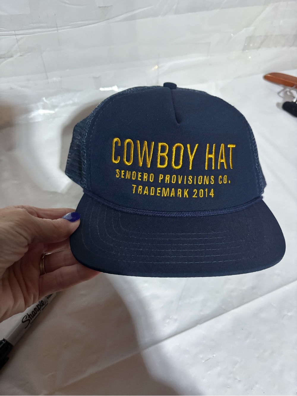 Sendero Provisions Navy Trucker Hat with Yellow Embroidery